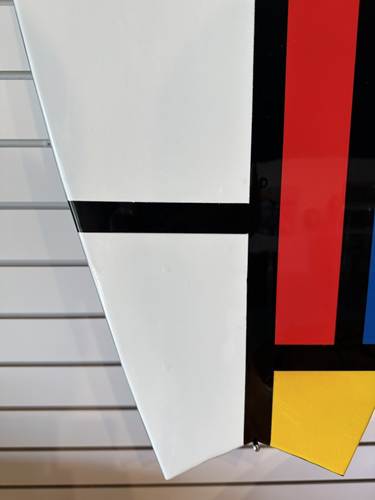 Decorative surfboard with Mondrian-inspired geometric art, limited edition gallery piece.