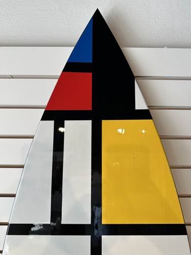 Decorative surfboard with Mondrian-inspired geometric art, limited edition gallery piece.