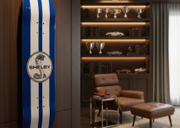 Hand-painted Shelby Cobra racing stripe skateboard mounted on a wood wall in a luxury home office study